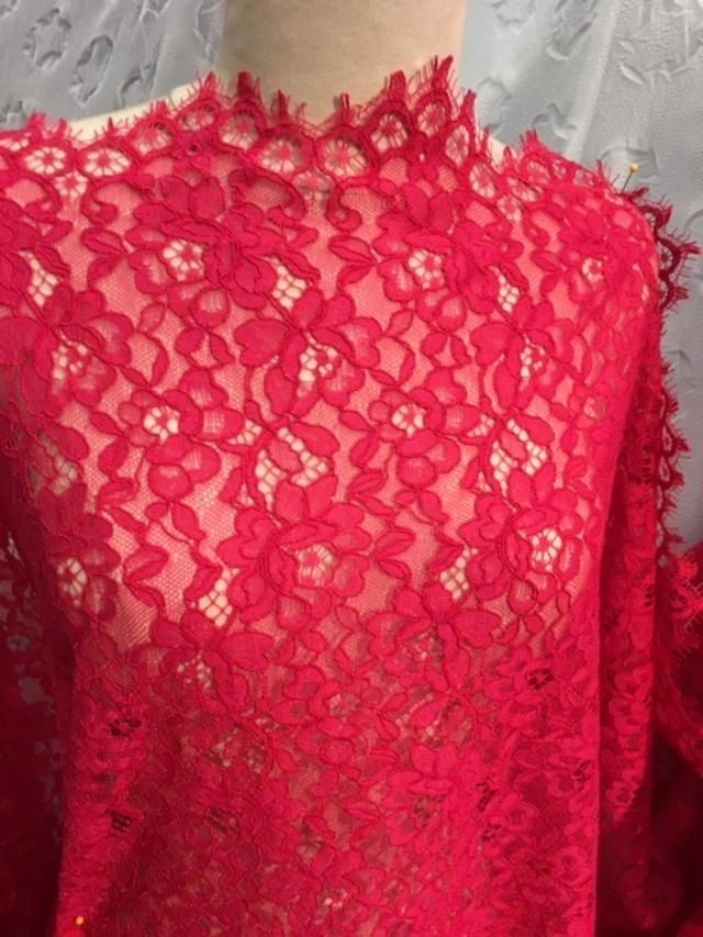 Floral Corded Texture Lace - Red Honeysuckle This novelty lace has beautiful, corded detail framing the edges of its floral design. Detailed scalloped edges on both salvages. An elegant choice for a dress, top, skirt, even an unlined jacket. 